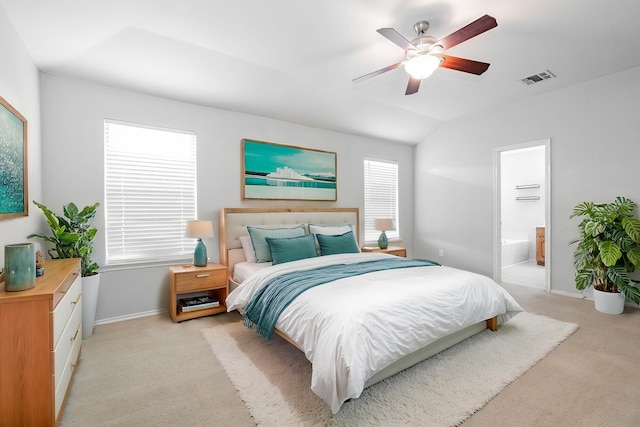bedroom with a ceiling fan, visible vents, baseboards, lofted ceiling, and light carpet
