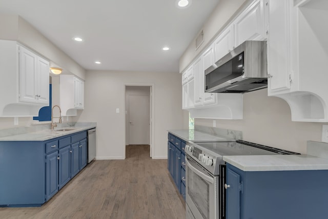 7804 Skylake Dr, Fort Worth, TX 76179 - kitchen with white cabinets, stainless steel appliances, a sink, and blue cabinets