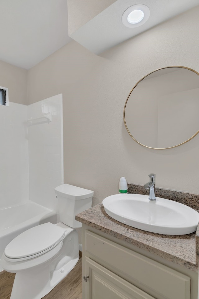 7804 Skylake Dr, Fort Worth, TX 76179 - bathroom with toilet, shower / washtub combination, wood finished floors, and vanity