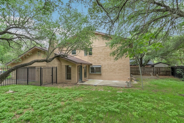 7804 Skylake Dr, Fort Worth, TX 76179 - back of house with a fenced backyard, a patio, a lawn, and brick siding