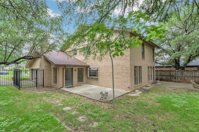 7804 Skylake Dr, Fort Worth, TX 76179 - back of house with a fenced backyard, a lawn, a patio area, and brick siding