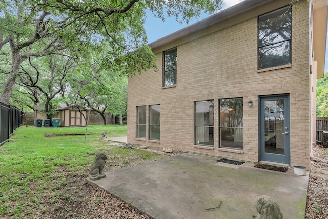 7804 Skylake Dr, Fort Worth, TX 76179 - back of property with a fenced backyard, a storage unit, a yard, and a patio area