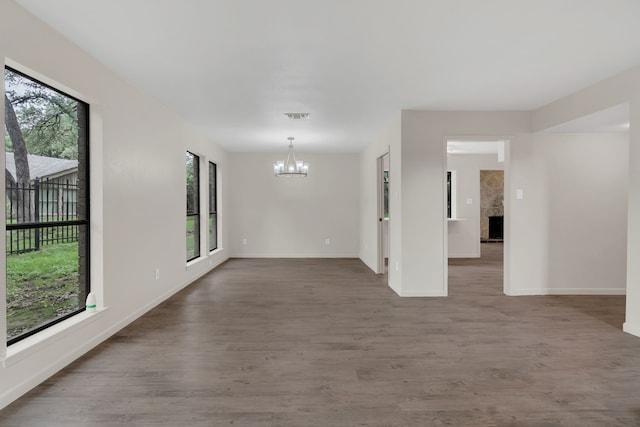 7804 Skylake Dr, Fort Worth, TX 76179 - empty room featuring baseboards, a chandelier, wood finished floors, and visible vents