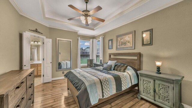1821 Sandpiper Dr, Weatherford, TX 76088 - bedroom with a tray ceiling, light wood-style flooring, crown molding, ceiling fan, and baseboards