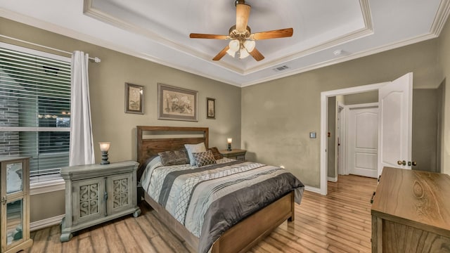 1821 Sandpiper Dr, Weatherford, TX 76088 - bedroom with a tray ceiling, ornamental molding, light wood-style flooring, baseboards, and a ceiling fan
