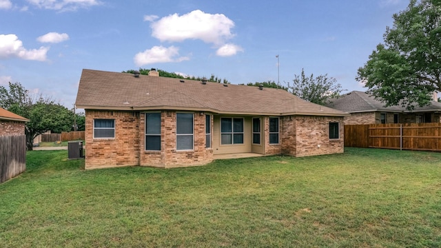 1821 Sandpiper Dr, Weatherford, TX 76088 - rear view of house featuring brick siding, central AC unit, and a chimney