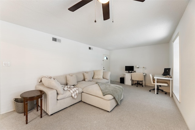 living room featuring ceiling fan, carpet flooring, and visible vents