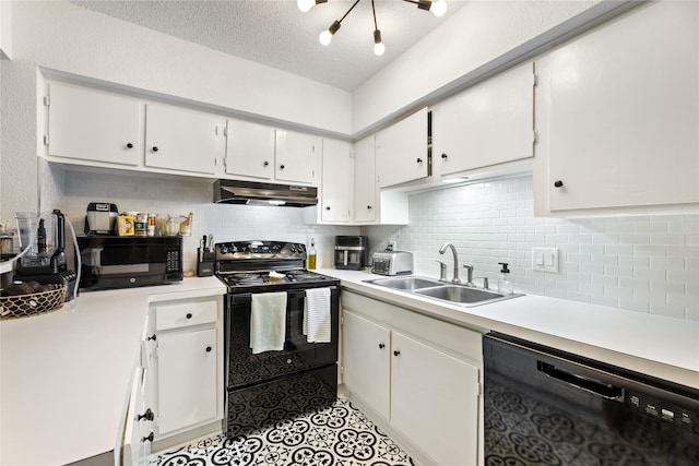 kitchen with white cabinets, a sink, decorative backsplash, under cabinet range hood, and black appliances