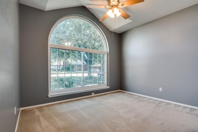 1521 Merritt Dr, Flower Mound, TX 75028 - empty room with plenty of natural light, carpet flooring, vaulted ceiling, and a ceiling fan