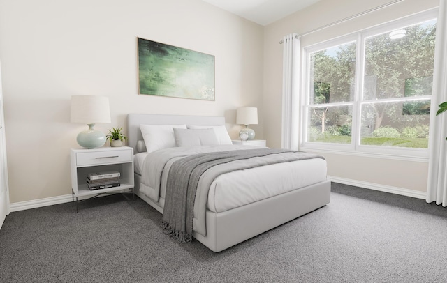 bedroom with carpet floors and baseboards