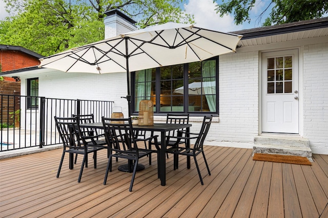 wooden deck featuring outdoor dining space
