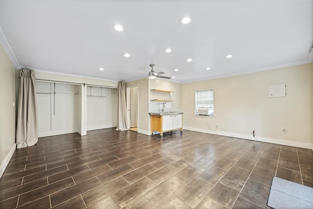 unfurnished living room featuring ceiling fan, dark wood finished floors, baseboards, ornamental molding, and recessed lighting