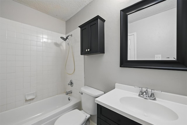 bathroom featuring shower / bath combination, a textured ceiling, toilet, and vanity
