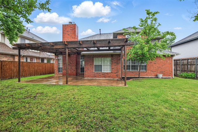 back of house with a pergola, a fenced backyard, a chimney, brick siding, and a patio area