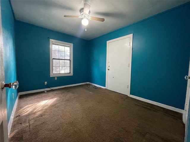 unfurnished room featuring baseboards, a ceiling fan, and carpet flooring