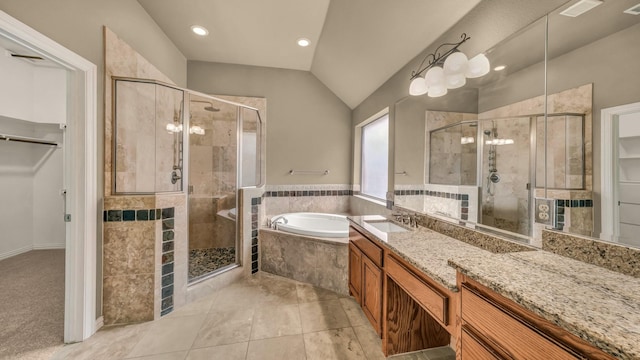 full bath featuring vanity, recessed lighting, a shower stall, vaulted ceiling, and a garden tub