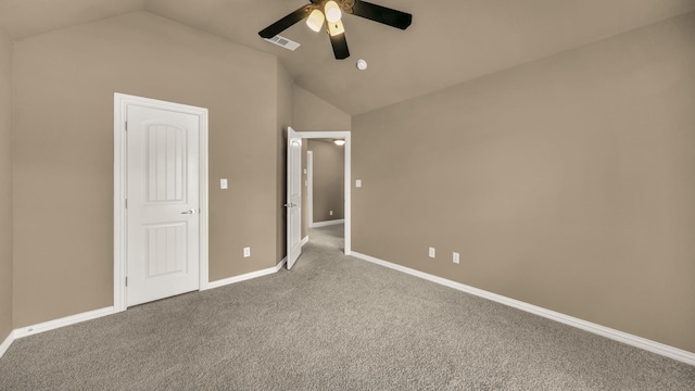 unfurnished bedroom featuring baseboards, visible vents, carpet flooring, and lofted ceiling