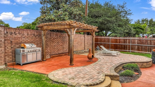 view of patio with a fenced backyard, a pergola, and grilling area