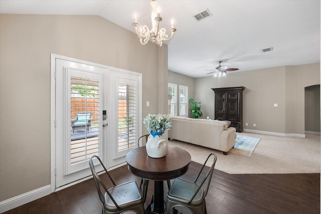 dining room featuring visible vents, baseboards, ceiling fan with notable chandelier, and wood finished floors