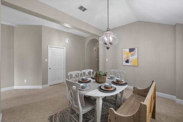 dining space with arched walkways, baseboards, light carpet, and visible vents