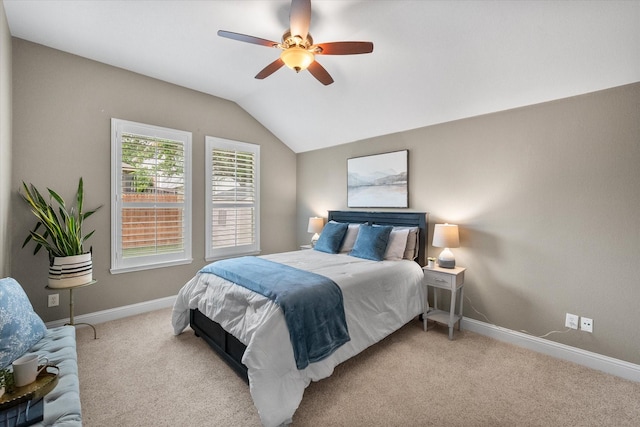 carpeted bedroom featuring baseboards, a ceiling fan, and lofted ceiling