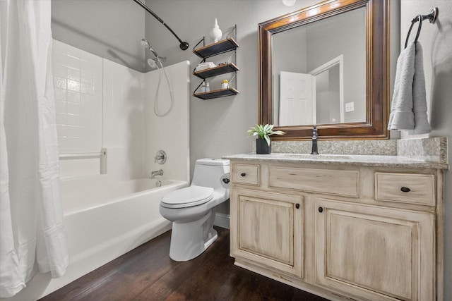 bathroom with vanity, wood finished floors, shower / bath combo, and toilet