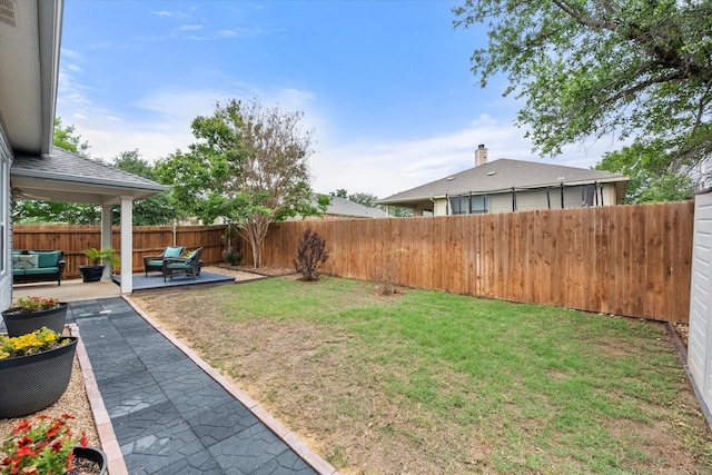 view of yard with an outdoor hangout area, a fenced backyard, and a patio area