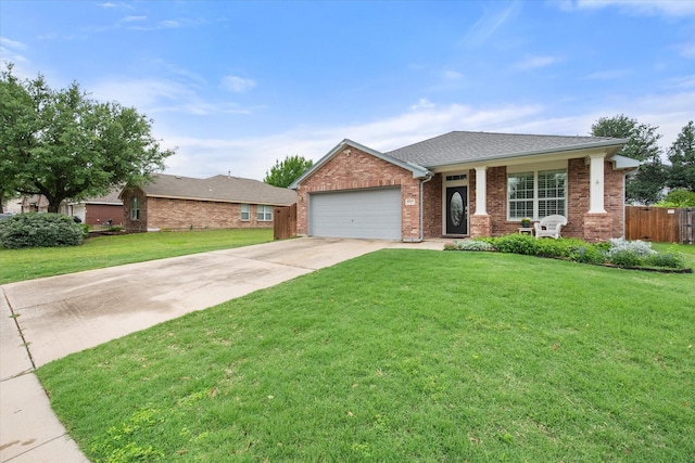 ranch-style home featuring an attached garage, a front lawn, fence, and concrete driveway