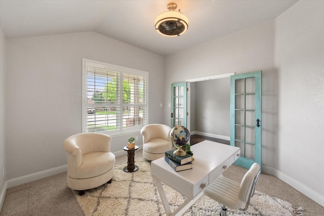 sitting room featuring baseboards, carpet floors, and lofted ceiling