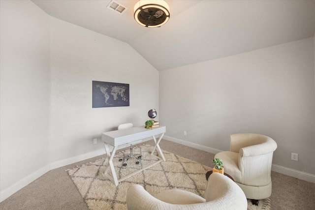 office area featuring carpet flooring, visible vents, and lofted ceiling
