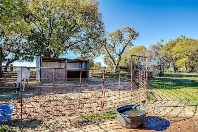 view of yard with an exterior structure and an outbuilding
