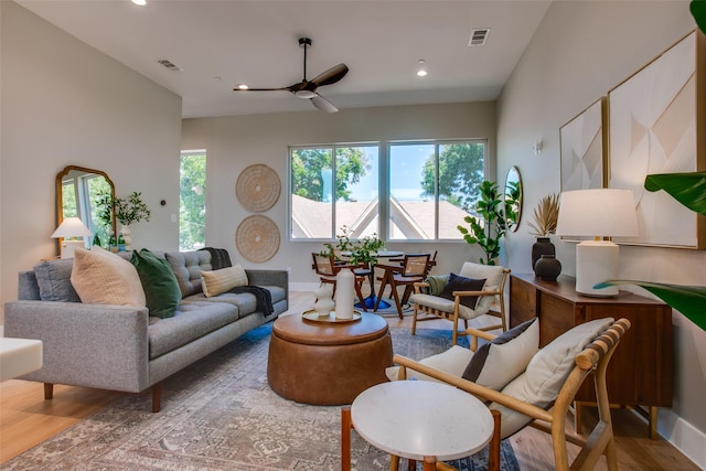 living room with recessed lighting, ceiling fan, visible vents, and wood finished floors
