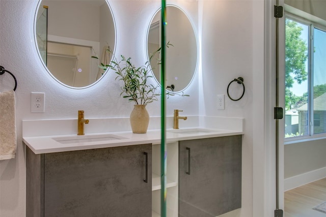 bathroom with double vanity and a sink