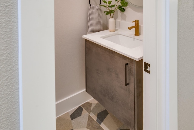 bathroom featuring tile patterned flooring and vanity
