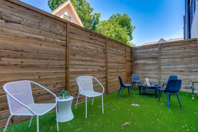 view of patio featuring fence