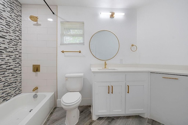 bathroom with toilet, shower / tub combination, wood finished floors, and vanity