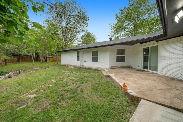 view of yard with fence and a patio area