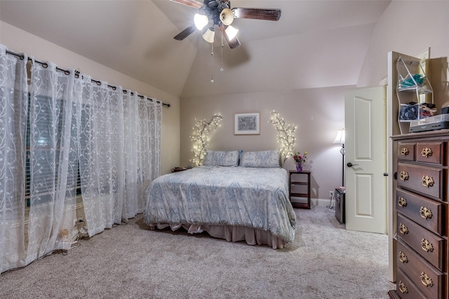 bedroom featuring vaulted ceiling, ceiling fan, and carpet flooring