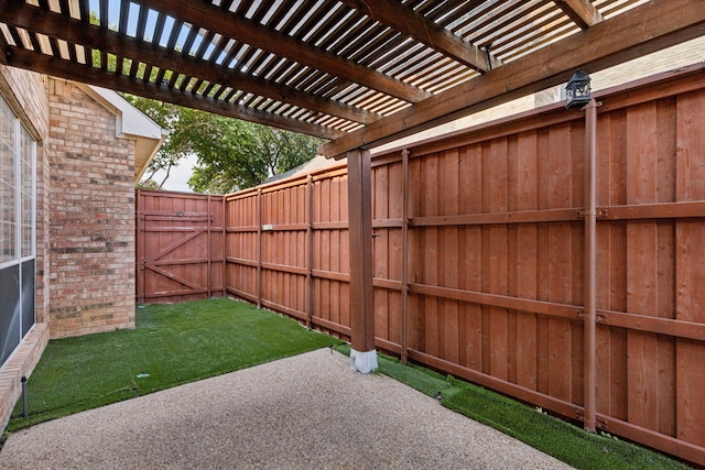 view of yard featuring a pergola, fence, and a patio area