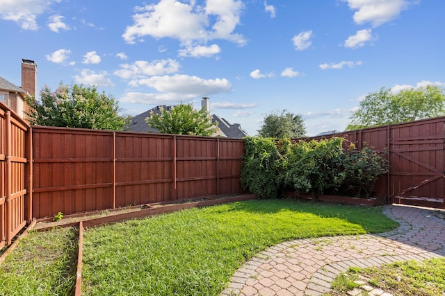view of yard featuring a fenced backyard