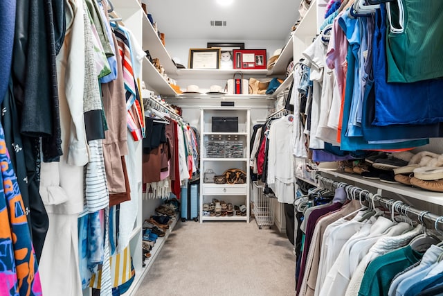 walk in closet featuring carpet flooring and visible vents