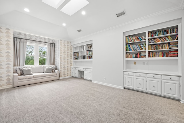 living area featuring a skylight, baseboards, and ornamental molding