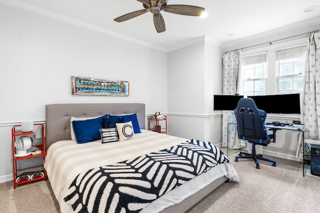 bedroom with crown molding, carpet flooring, and baseboards