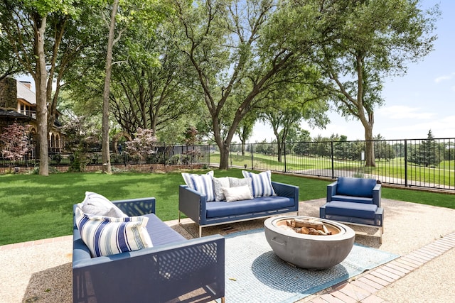 view of patio / terrace featuring an outdoor living space with a fire pit and fence