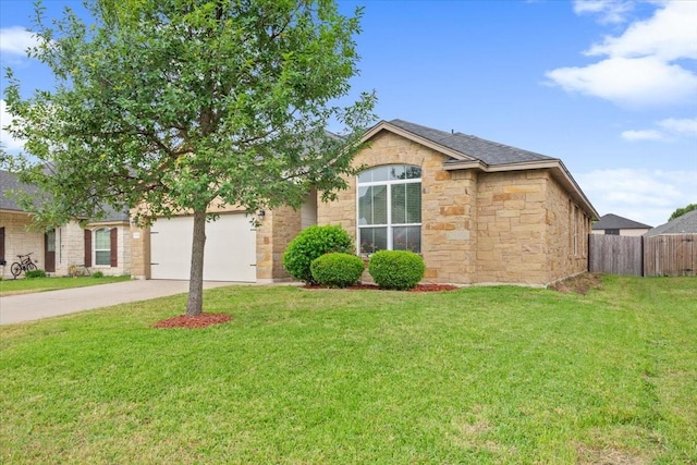 single story home featuring fence, an attached garage, a front lawn, stone siding, and concrete driveway
