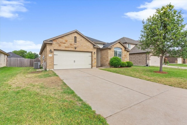 ranch-style house with a garage, fence, stone siding, central AC unit, and driveway