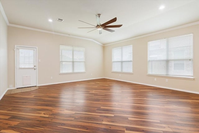 unfurnished room featuring crown molding, a ceiling fan, visible vents, and wood finished floors