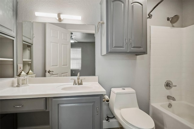 bathroom featuring toilet, washtub / shower combination, and vanity