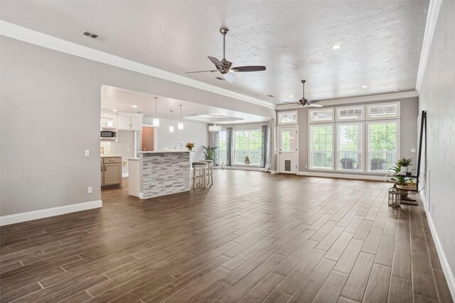 7312 Bishop Ct, Fort Worth, TX 76179 - unfurnished living room featuring baseboards, ceiling fan, ornamental molding, recessed lighting, and dark wood-style floors
