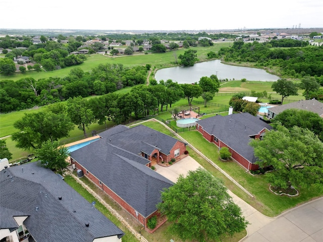birds eye view of property featuring a water view and a residential view